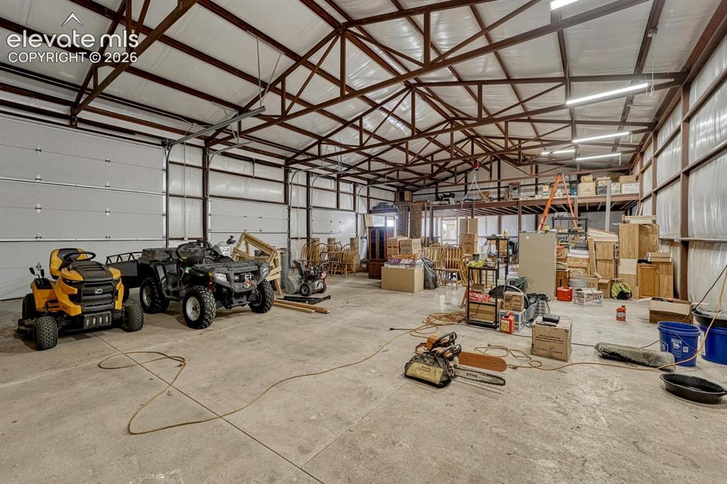 Image 38 of 50: 64 x 36sqf shop. Steel trusses, polished concrete floors, elec. mezzanine l