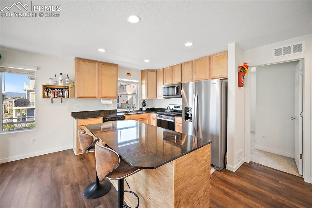 Image 13 of 38: Owner added the awesome island creating more storage. 