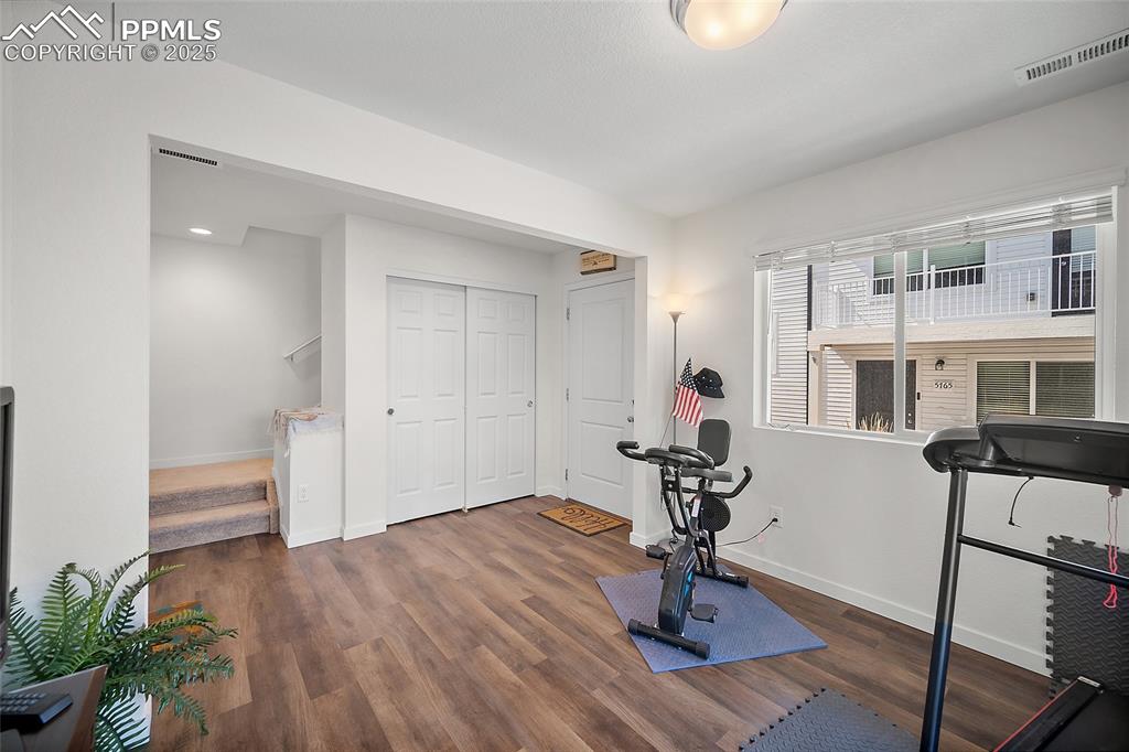 Image 6 of 38: Walking into the home is a great flex space. Home office, exercise room, et