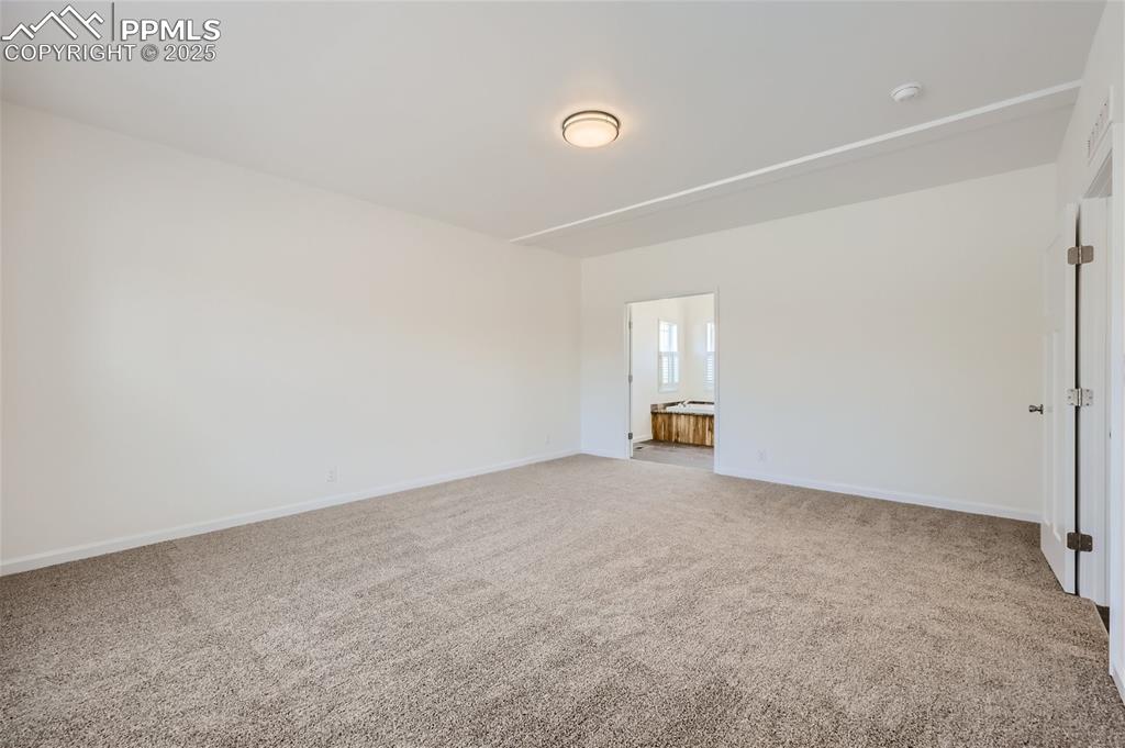 Image 11 of 16: Spare room with light colored carpet
