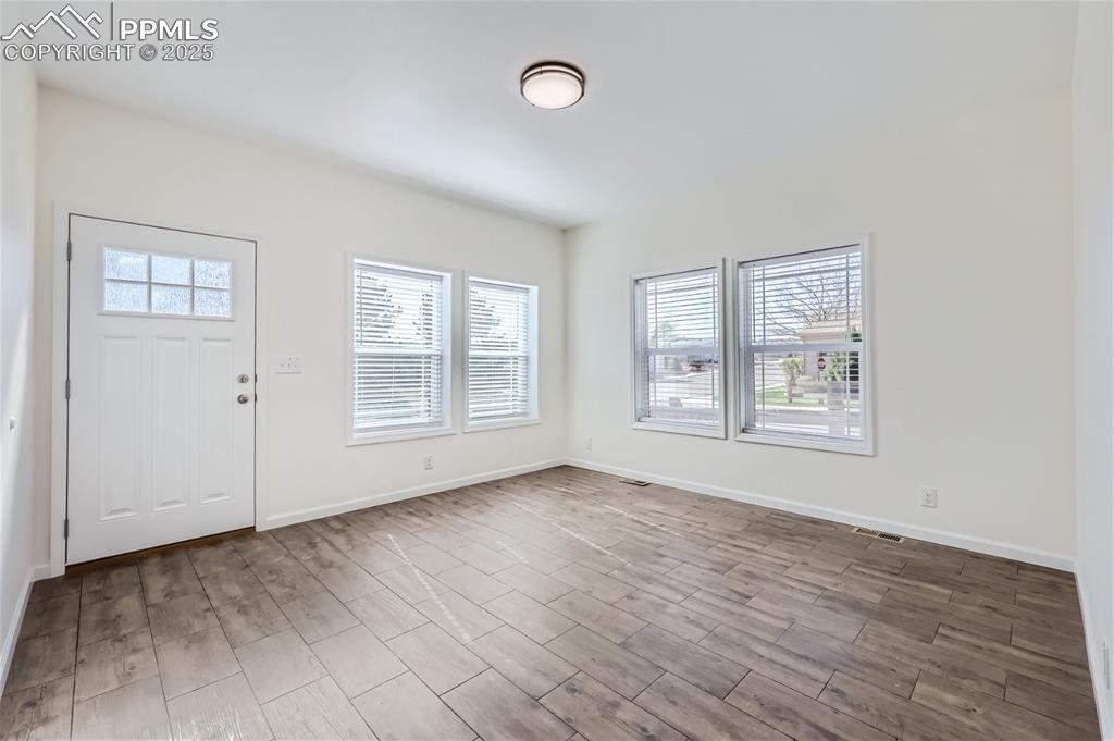 Image 6 of 16: Entrance foyer featuring wood finished floors