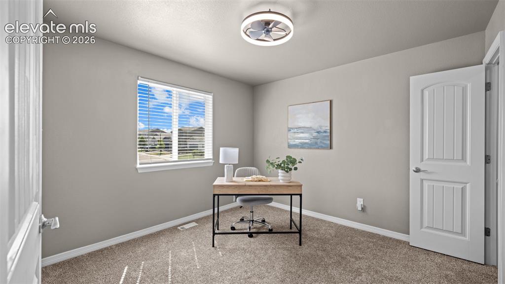 Image 18 of 43: Neutral tone wall paint with carpet flooring