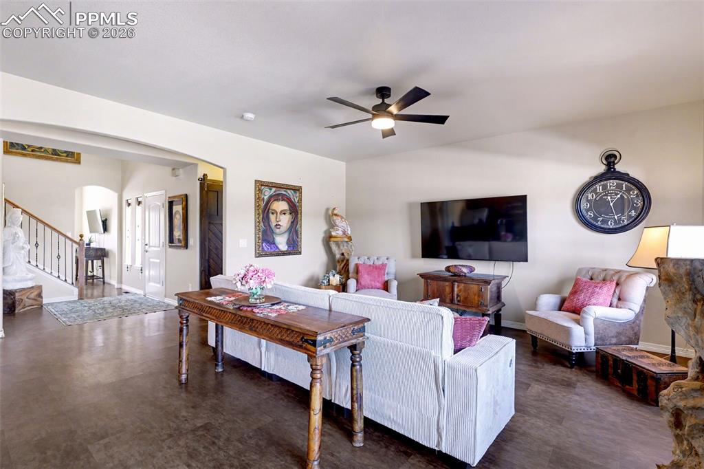 Image 12 of 43: Walkout to a spacious deck from the living room