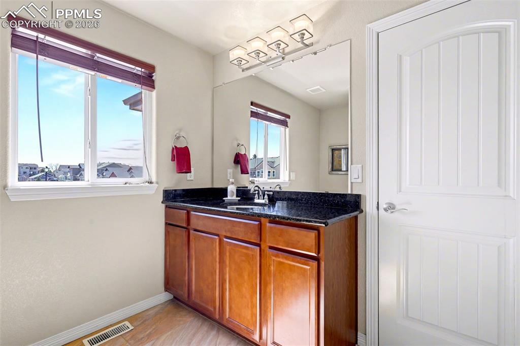 Image 31 of 43: Upper level full bathroom