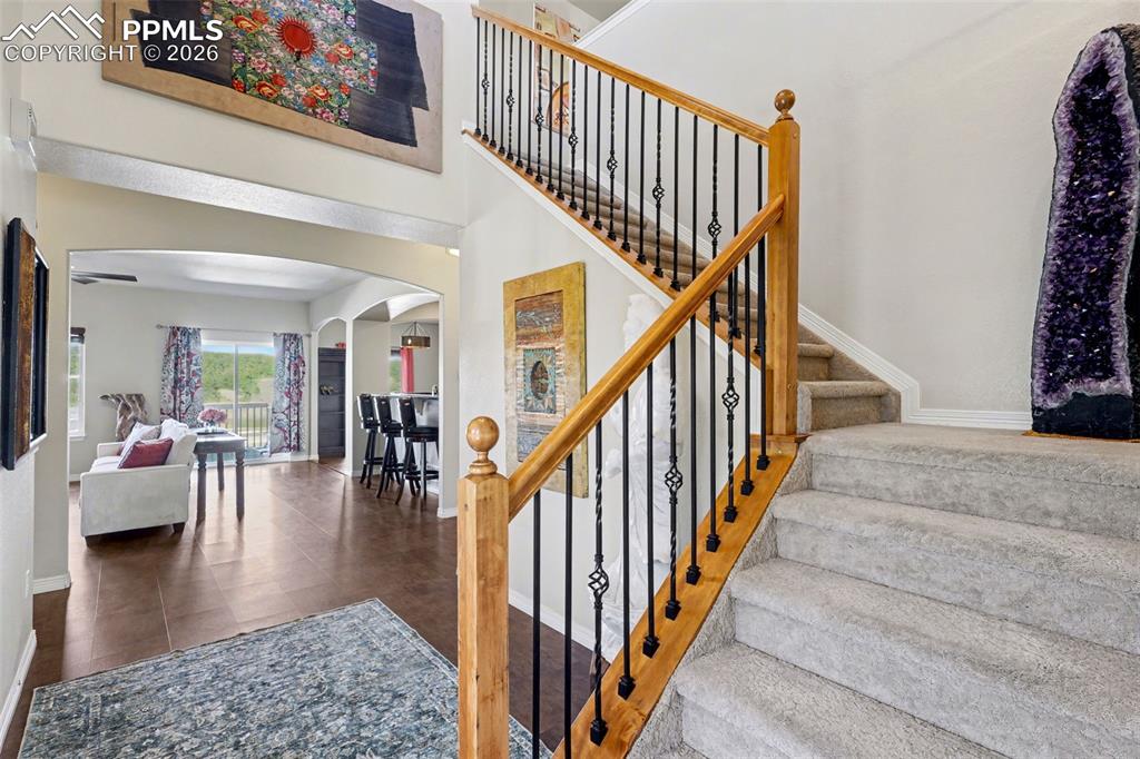 Image 5 of 43: Entry opens to the open-style family room/kitchen combo