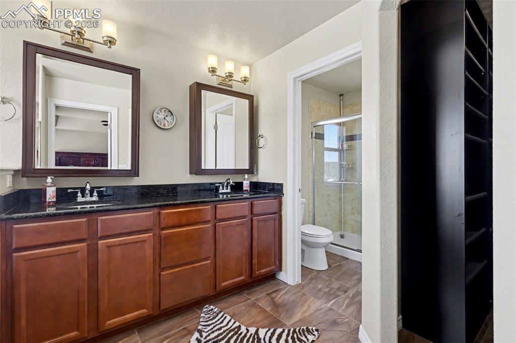 Image 9 of 43: Primary bathroom has a Spa-like feel with a fireplace!