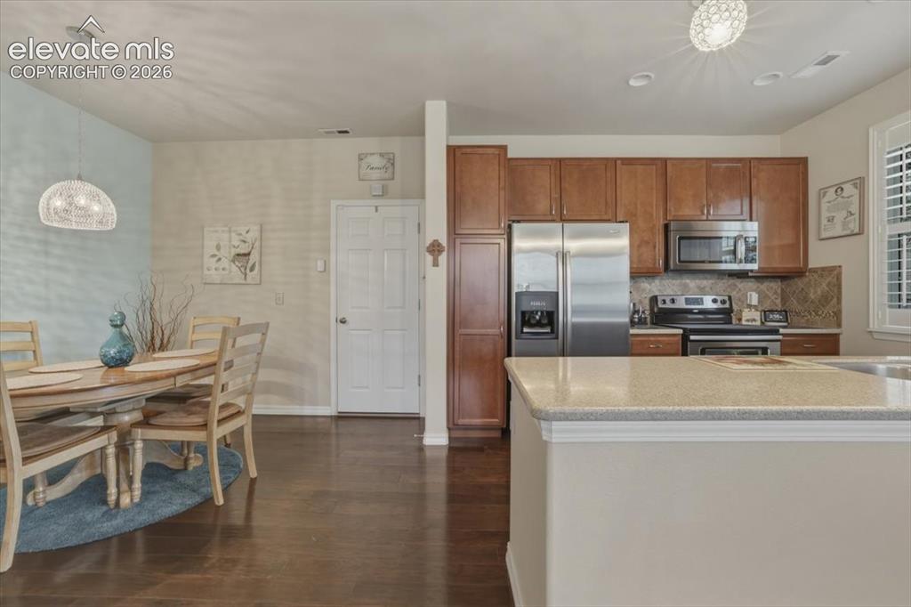 Image 14 of 47: Kitchen and dining area.