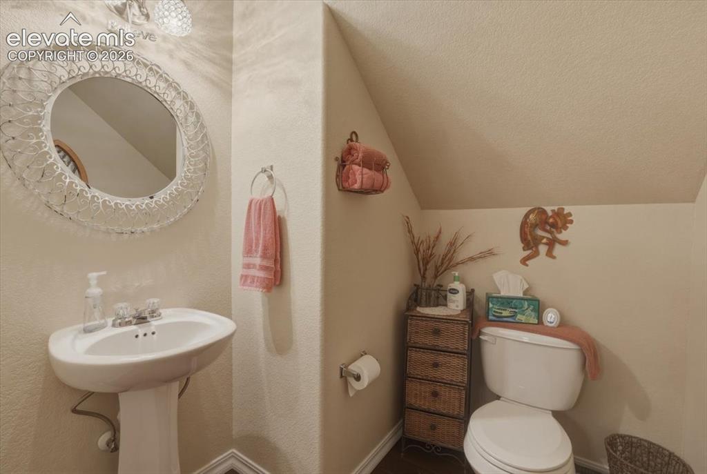 Image 17 of 47: Main level guest bathroom.