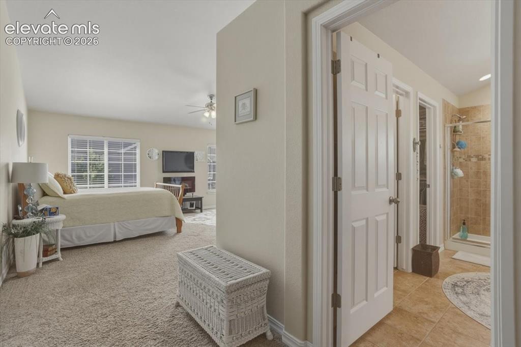 Image 18 of 47: Upper level primary bedroom.