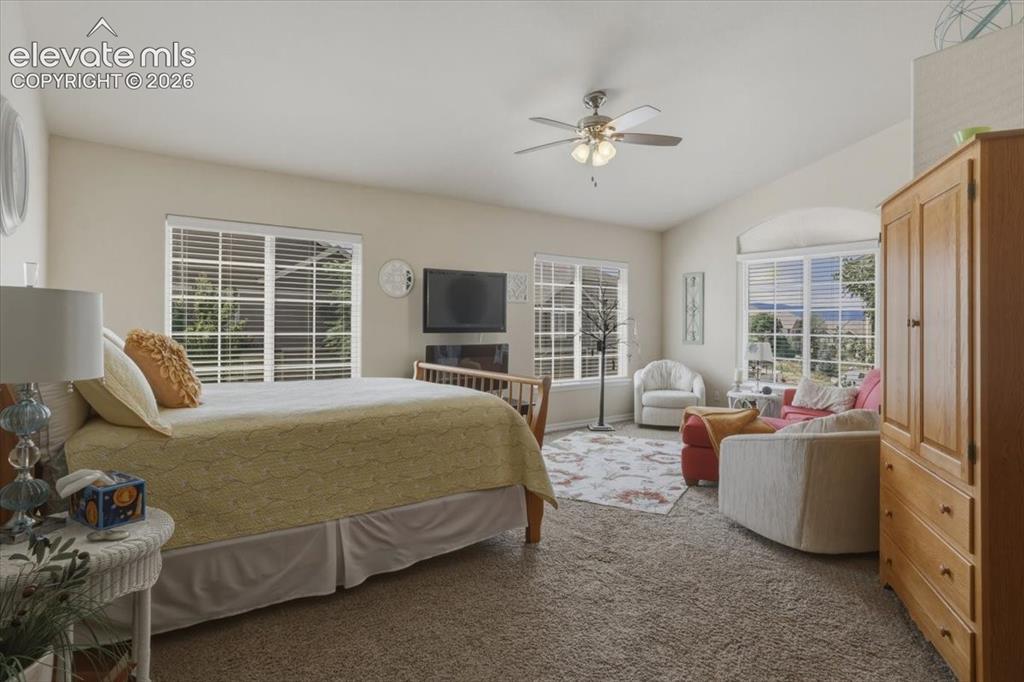 Image 19 of 47: Primary bedroom with sitting area.