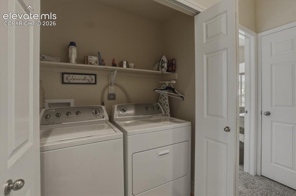 Image 35 of 47: Upper level washer and dryer.