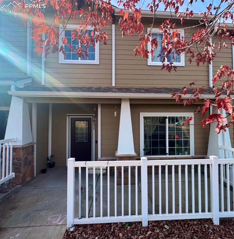 Image 2 of 21: Property entrance with covered porch
