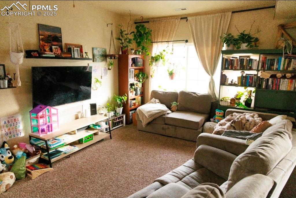 Image 4 of 21: View of carpeted living room