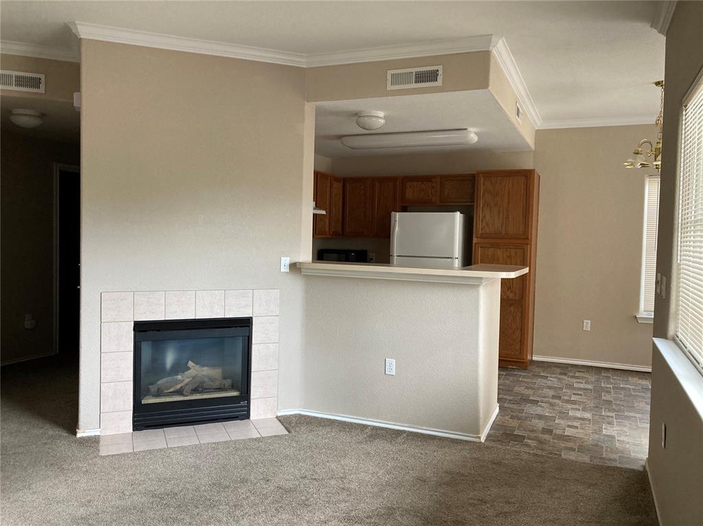 Image 3 of 7: Living room with gas fireplace