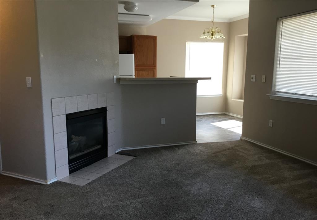 Image 4 of 7: Living room looking toward dining room