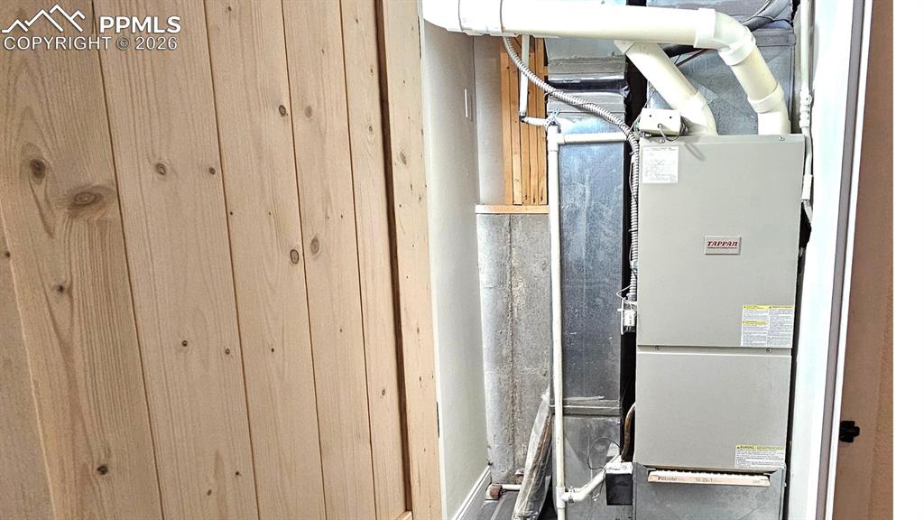 Image 14 of 41: HVAC Room with FH Style door.