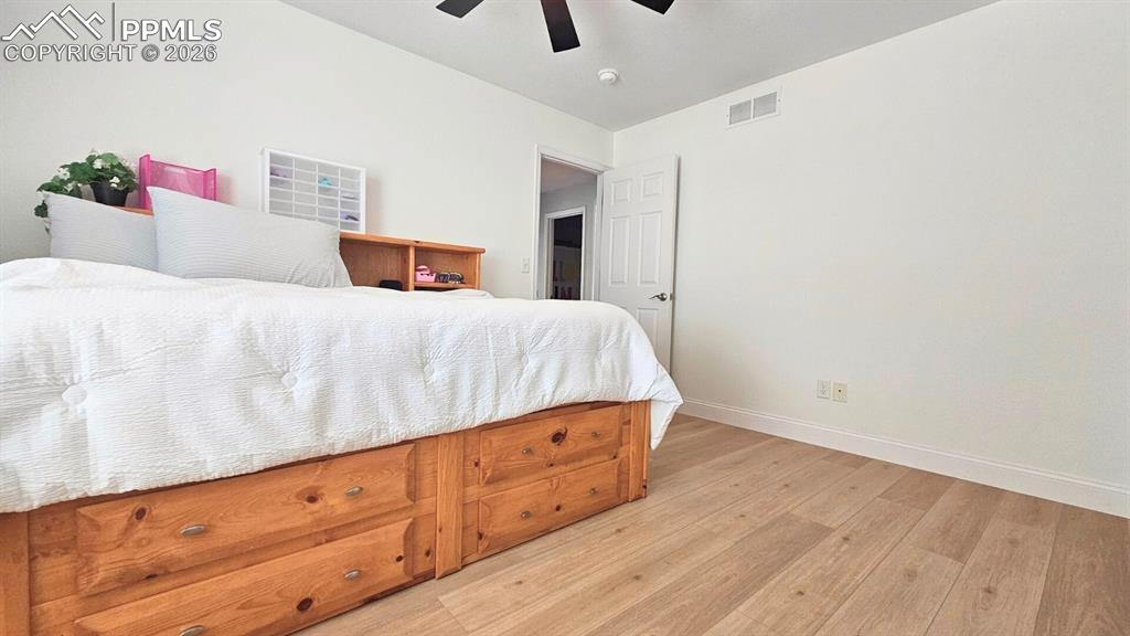 Image 23 of 41: Bedroom 5 - with new paint baseboards and floors