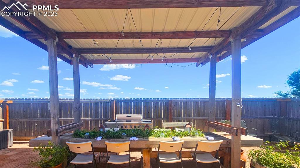 Image 27 of 41: Covered Cedar Table with Galvanized metal and views
