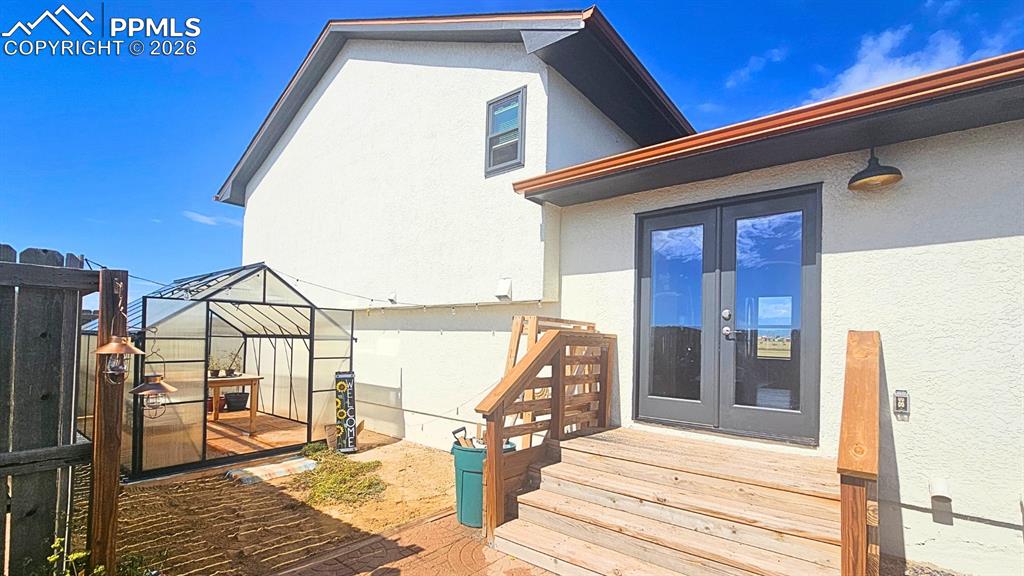 Image 29 of 41: Outdoor area with wood landings to sit and relax on the steps