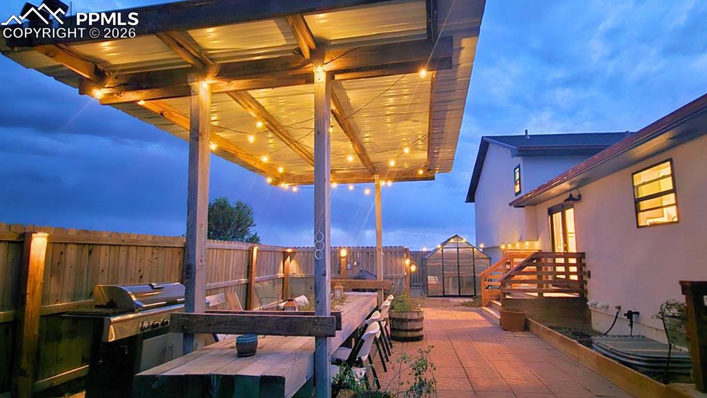 Image 33 of 41: Deck at Dusk!  With warm lighting