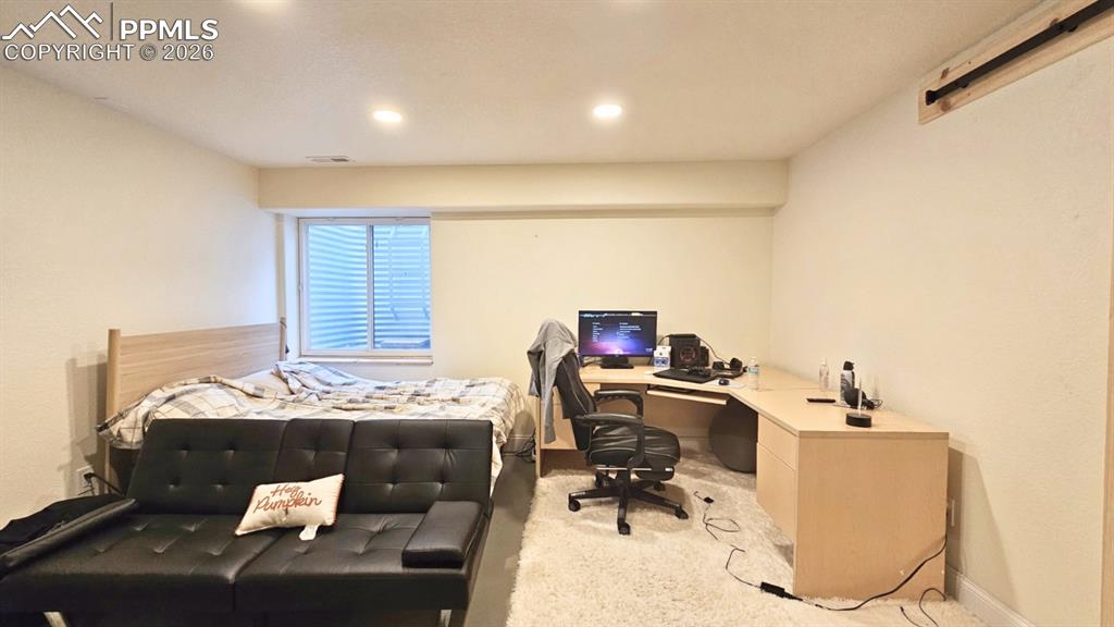 Image 9 of 41: Basement Bedroom - that can also double as a Basement Bunkhouse - with 4 Bu