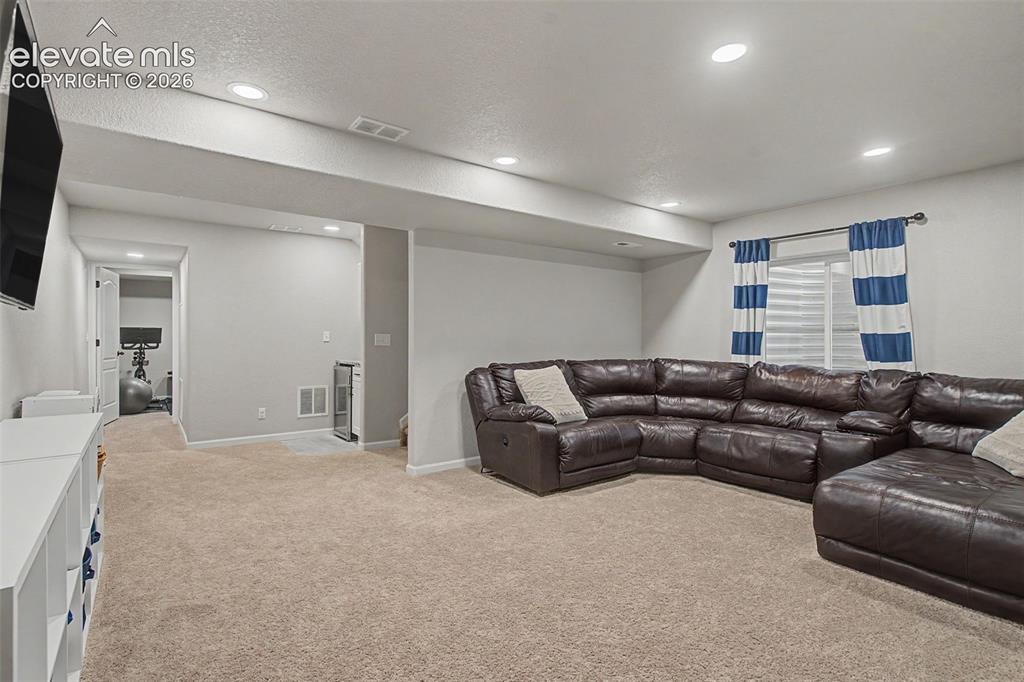 Image 29 of 46: Finished basement family room