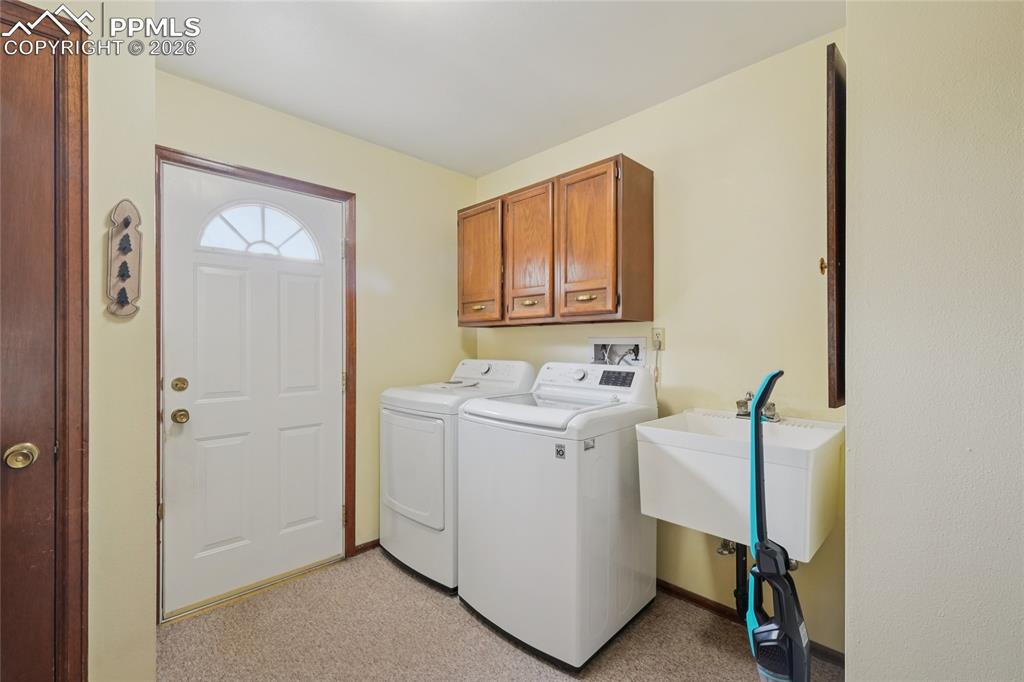 Image 18 of 48: Laundery is on the main with laundry sink.