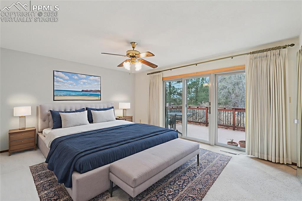 Image 19 of 48: Virtually Staged. On one side of the main level is the primary suite.