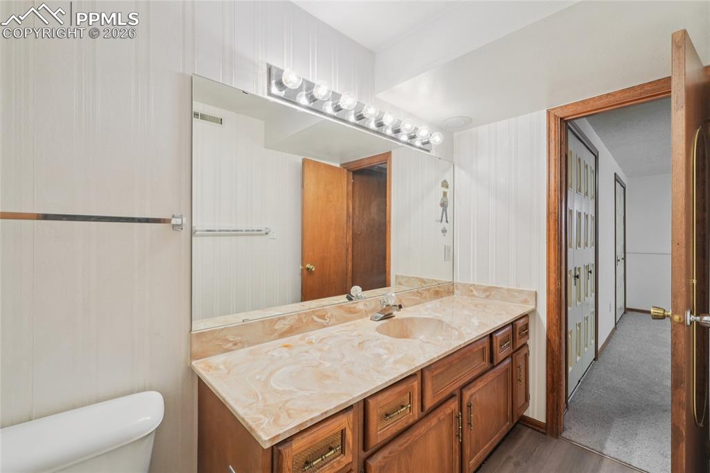 Image 30 of 48: This is the downstairs bath with attached bathroom.