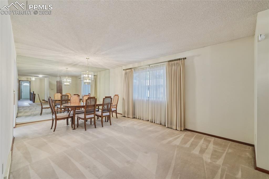 Image 5 of 48: The formal dining nook can be as big or small as you want, this room is ver