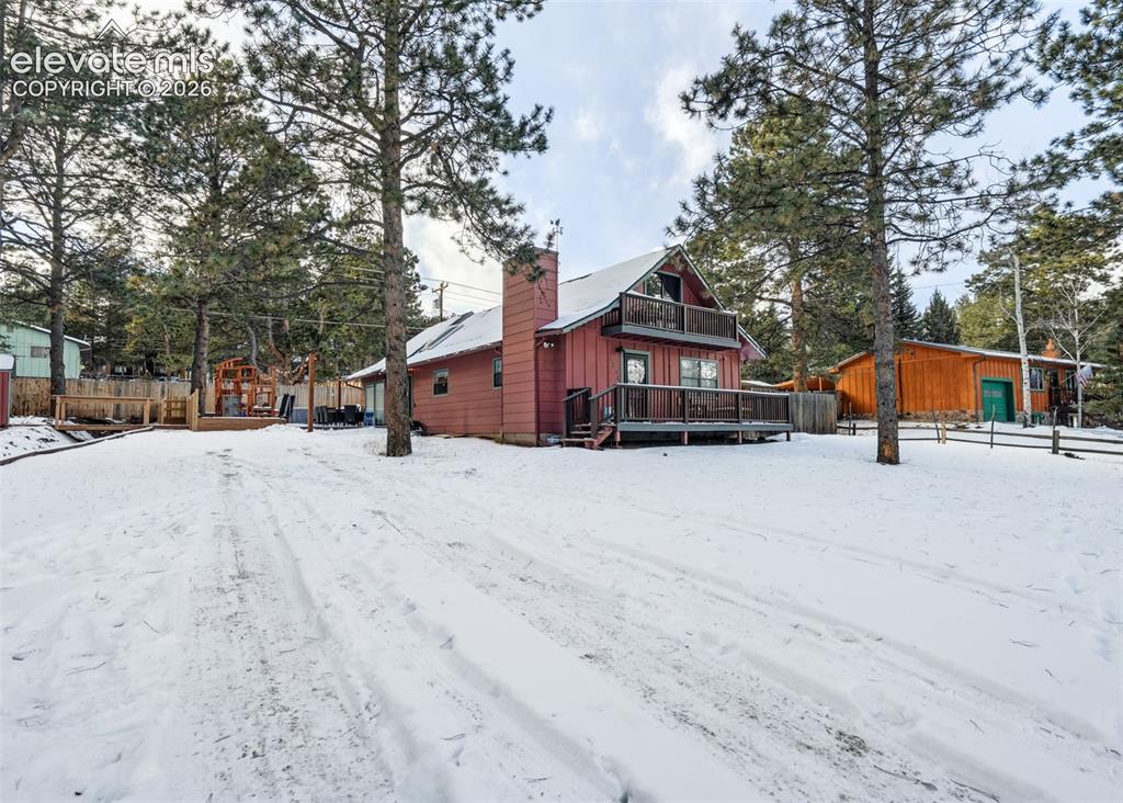 Image 1 of 49: Frontal viewing of the house with a wide open driveway, with plenty of spac