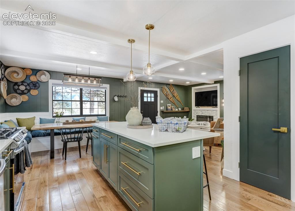 Image 19 of 49: This kitchen has a beautiful island included in its open floor plan.