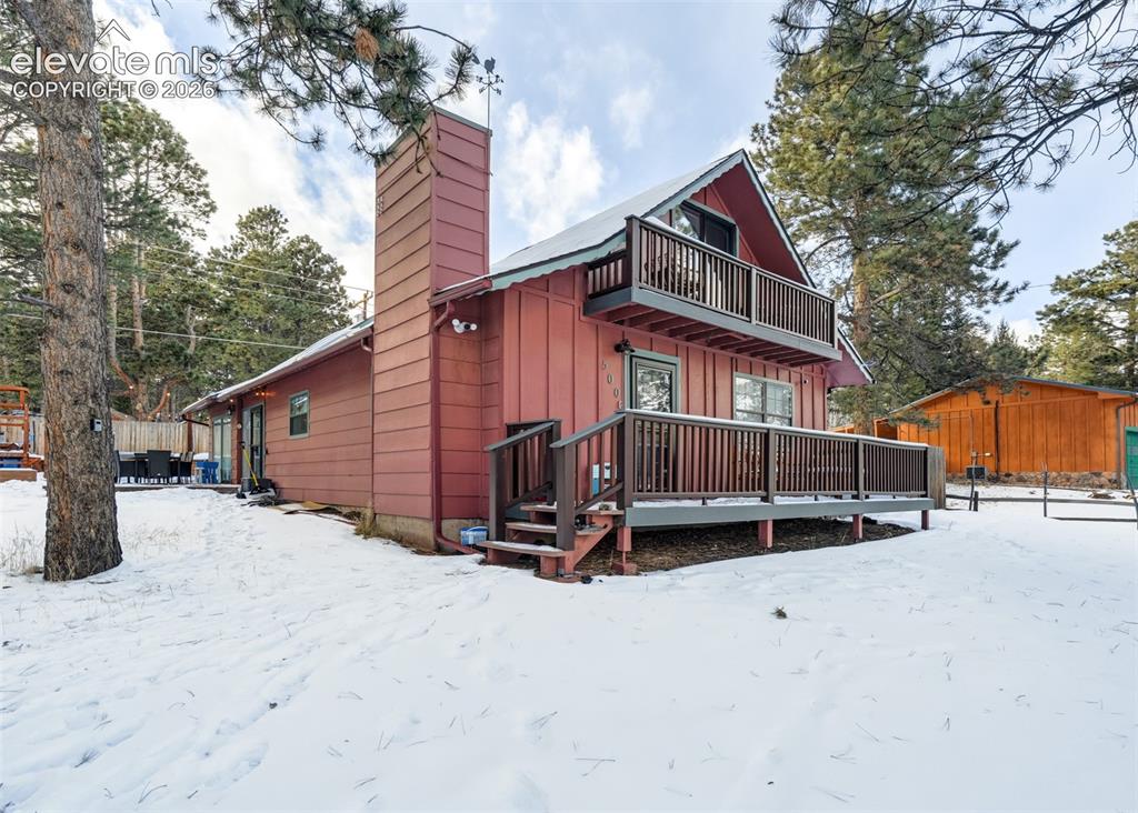 Image 2 of 49: the beautiful front porch with an amazing view where the whole family can e