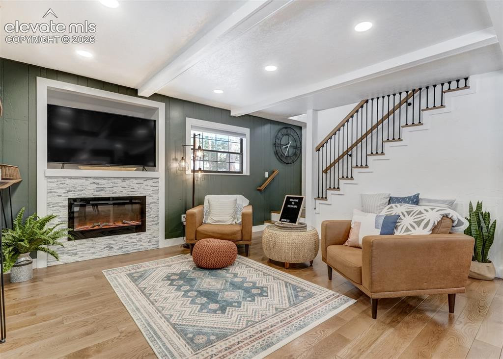 Image 6 of 49: The living room is open area, connecting the kitchen, and also the dining r