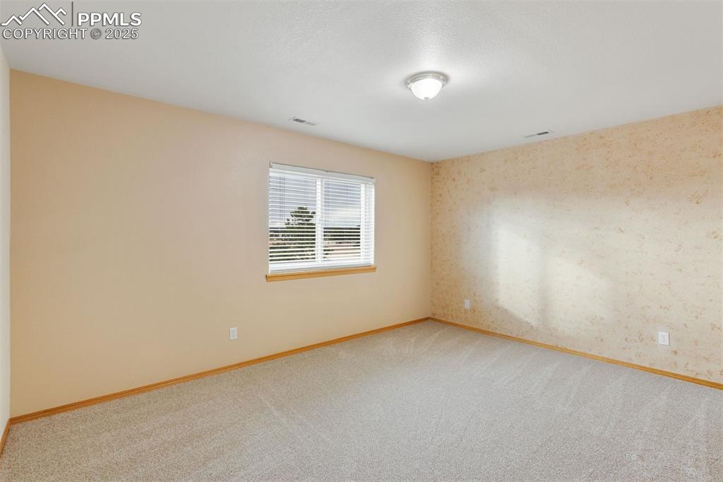 Image 31 of 41: Bedroom located in basement