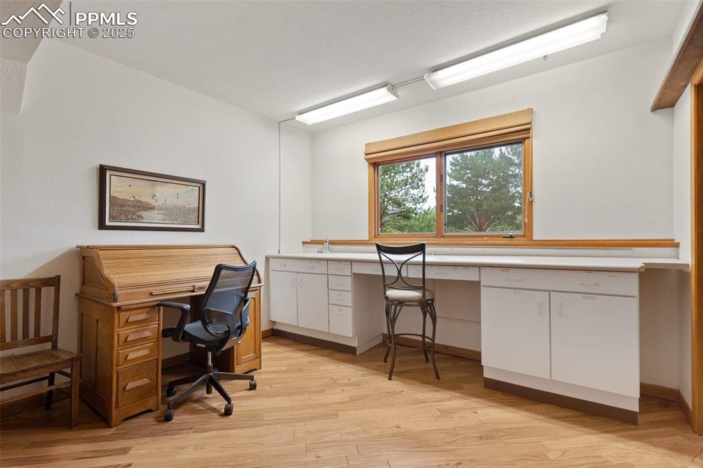 Image 32 of 49: This room is nexr to entrance to garage. Could also be a flex room of any k
