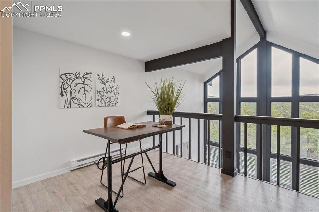 Image 18 of 44: Office area with beamed ceiling, baseboard heating, high vaulted ceiling, l