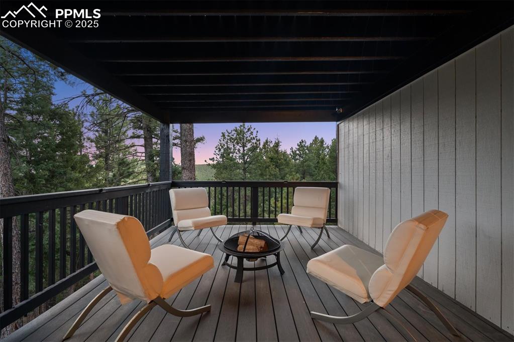 Image 31 of 44: Deck with an outdoor fire pit