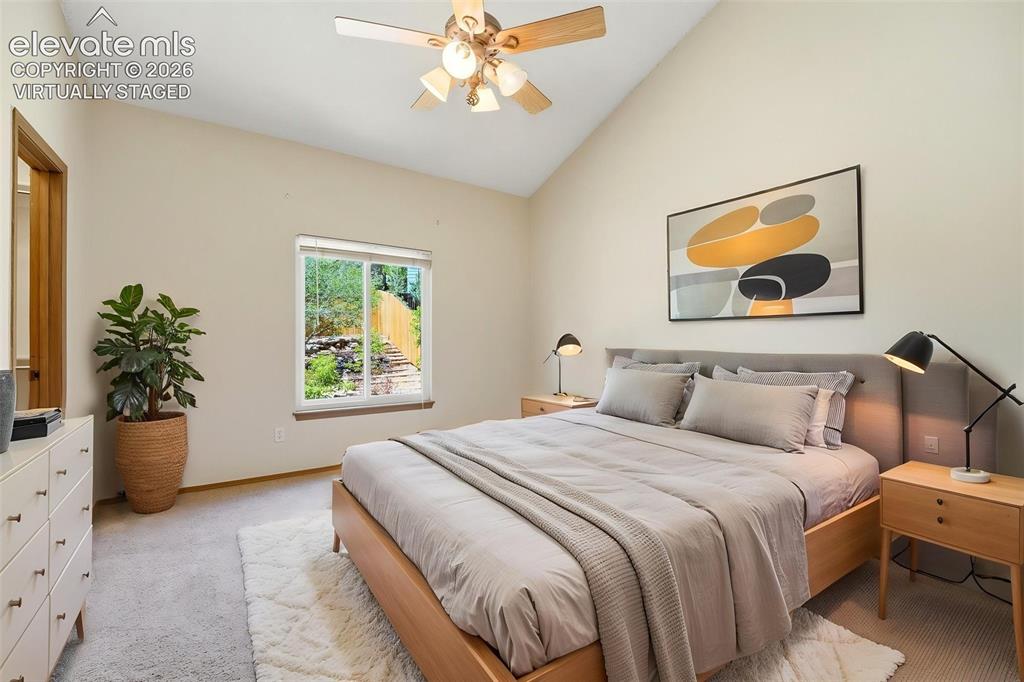 Image 11 of 30: (Virtually Staged) Vaulted ceiling with a ceiling fan light fixture, light-