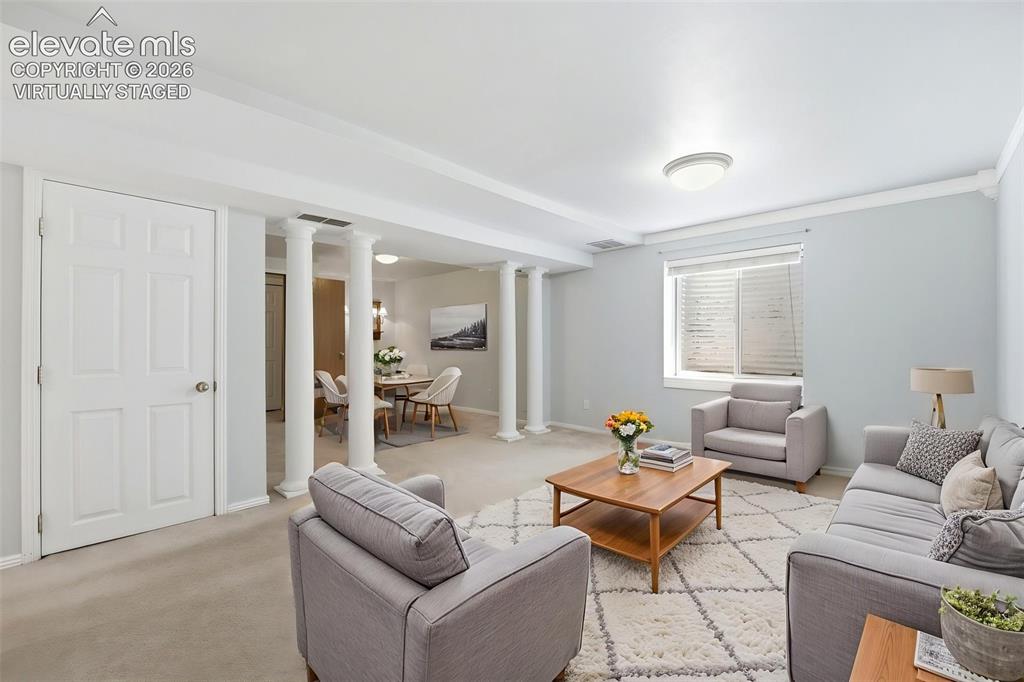 Image 17 of 30: (Virtually Staged) Open-concept living area featuring light-colored carpet,
