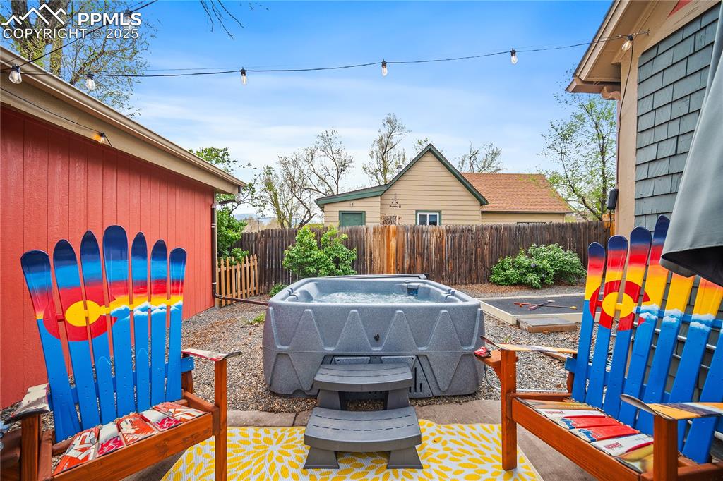 Image 16 of 47: View of patio featuring fence and area for grilling