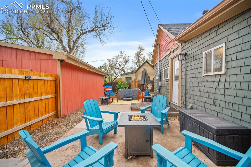 Image 19 of 47: View of patio / terrace with fence and a fire pit