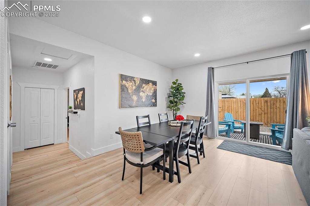 Image 29 of 47: Dining room featuring attic access, visible vents, baseboards, recessed lig