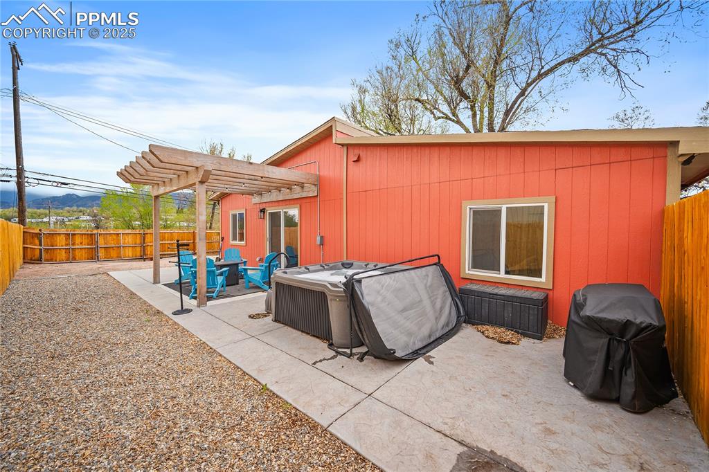 Image 39 of 47: View of patio / terrace with a fenced backyard, a pergola, and a grill