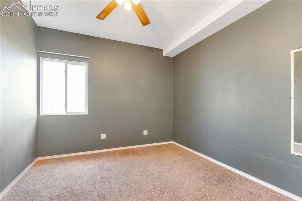 Image 35 of 46: Carpeted empty room with ceiling fan and baseboards