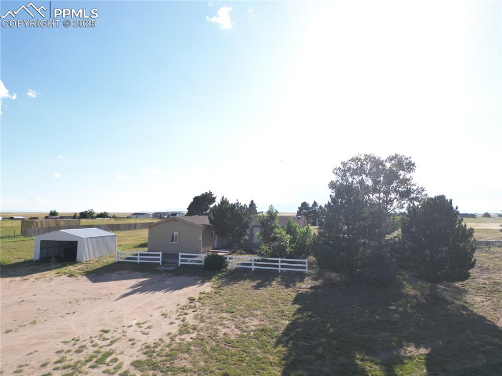 Image 39 of 46: View of yard featuring a pole building, a view of rural / pastoral area, an