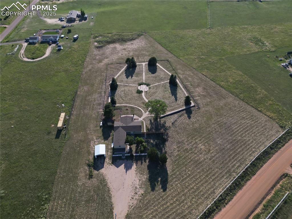 Image 44 of 46: Aerial view of property and surrounding area featuring rural landscape