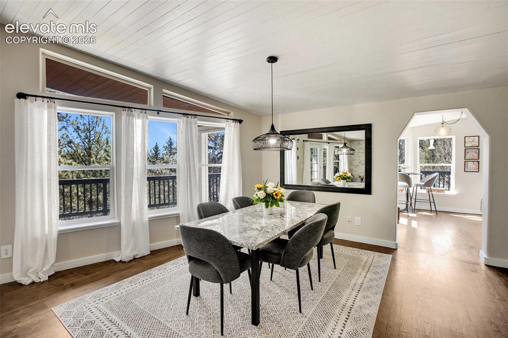Image 8 of 46: Main level dining with ample natural light