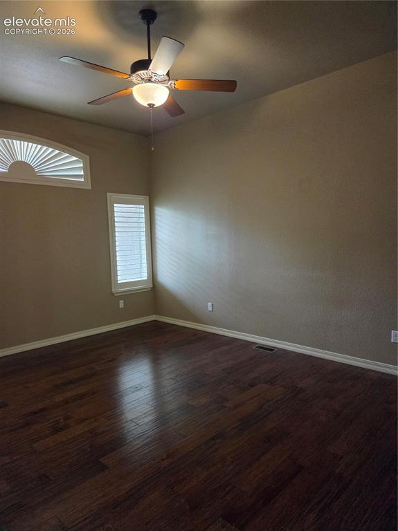 Image 18 of 33: OPEN- Wood-finish flooring throughout, featuring a ceiling fan with integra