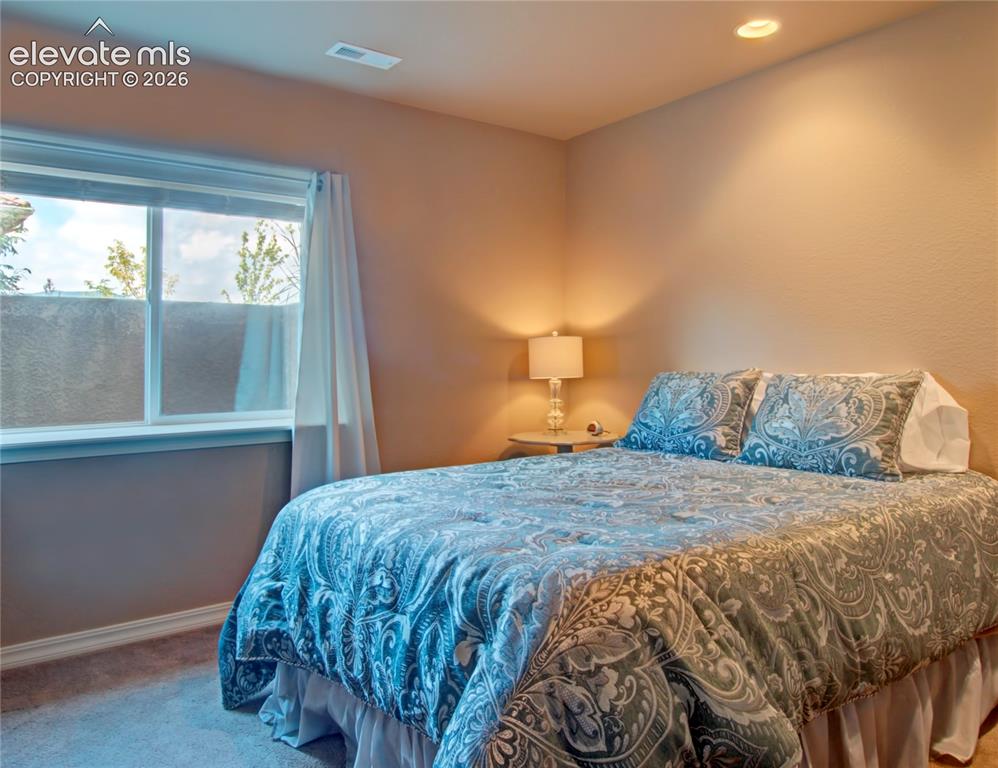 Image 29 of 33: Fourth lower bedroom with Recessed ceiling lighting illuminates a room feat
